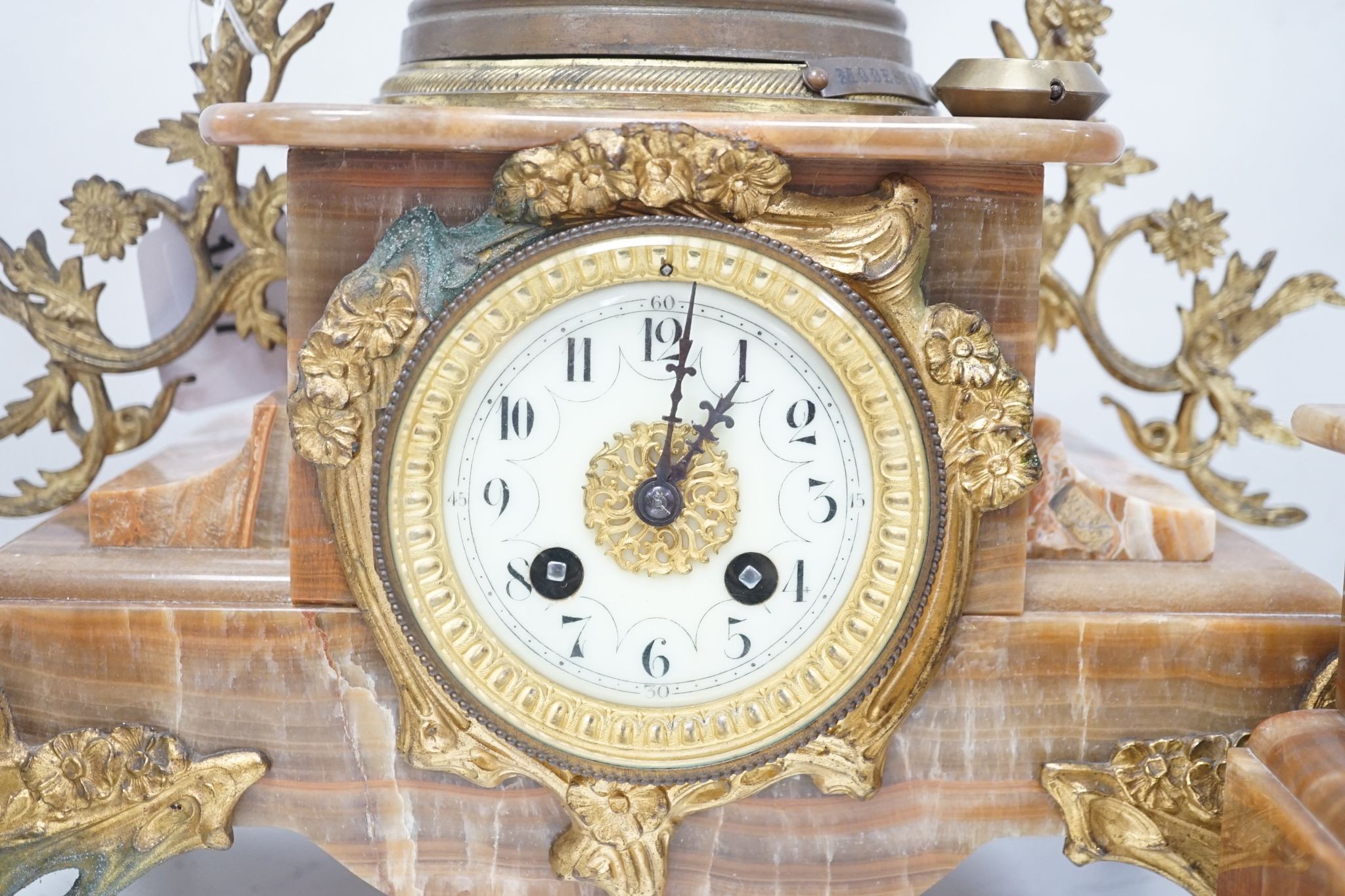 A French onyx and spelter figural clock garniture 66cm